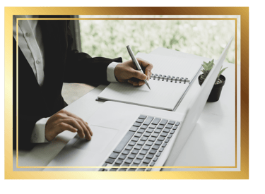 working professional writing in a notebook