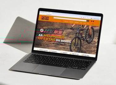 a laptop computer screen showing a website page on the left side of the screen
