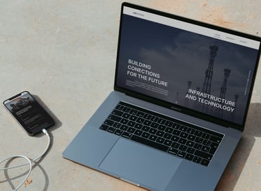 a laptop computer and a cell phone on a table
