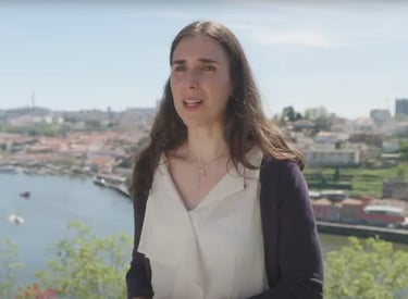 a woman in a white dress and a black jacket