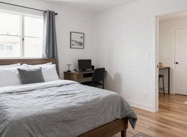 A professional cleaner carefully wiping a modern living room window, sunlight streaming in.