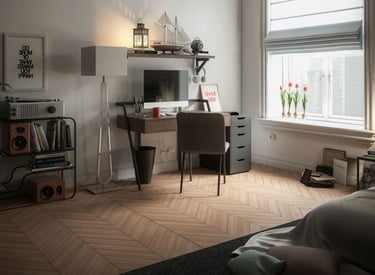 Modern studio apartment with a desk, record player, and herringbone wood floor by a window.