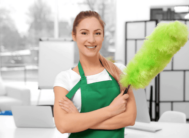 a woman in green aprons holding a green duster