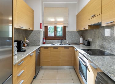 Fully equipped kitchen at Theseus Retreat holiday rental in Aphrodite Hills Resort, Cyprus
