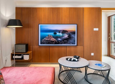 View from the sofa towards the entertainment unit and art TV at Theseus Retreat holiday rental