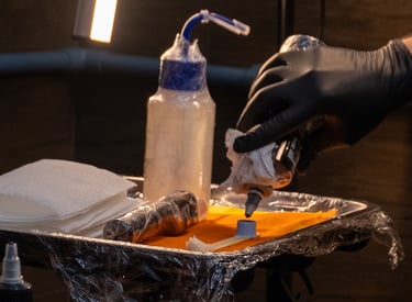 a person in gloves and gloves is putting something in a container