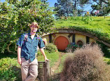 Steven checking out the hobbit-holes in Hobbiton in New Zealand