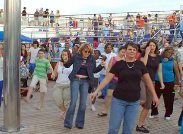 Sheila and Lady at the sail away party on Carnival Glory