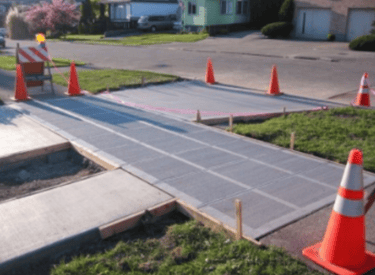 a road with orange cones and orange cones