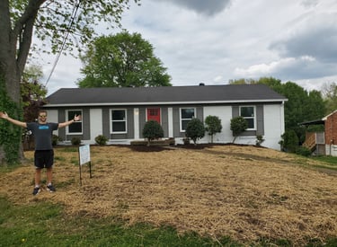 a man standing in front of a house