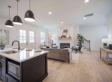 a kitchen with a stove top oven and a sink