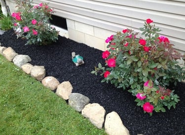 A new layer of mulch, rock, or pine bark can dramatically improve the aesthetics of your garden beds