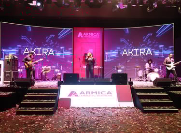 a band playing a song on stage at an event