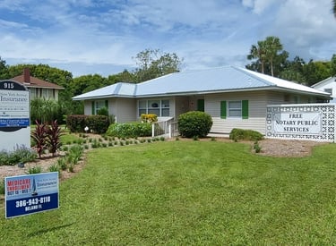 a house with a sign that says,"New York Avenue Insurance"