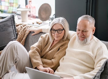 a man and woman sitting on a couch