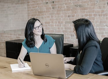 woman giving consultation to another woman