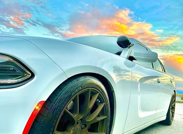 White Dodge Charger with copper chrome rims parked on the Blue Ridge Parkway for auto locksmith services