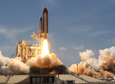 a space shuttle carrying a rocket carrying a rocket