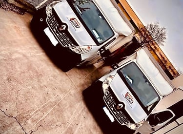 two trucks parked in a parking lot