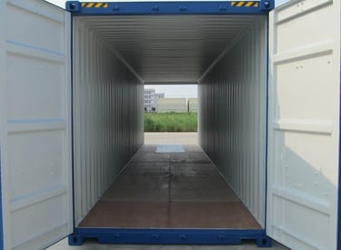 Inside view of an empty blue shipping container with open doors for storage and transport logistics.