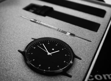 a clock on a box with a watch on it