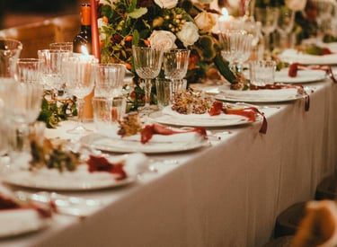 a table with a long table set for a wedding