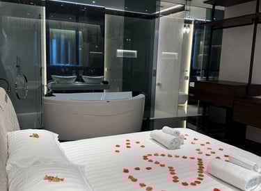 a bed with a large bed and a bathtub