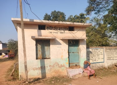 Old woman sit front of shop