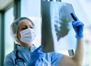 Nurse looking at the x-ray report