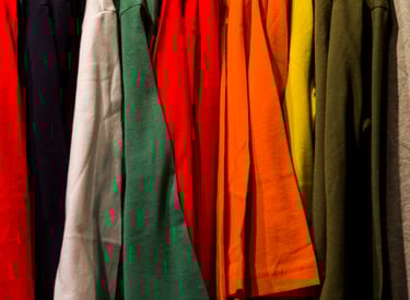 Rack of colourful tshirts on a rack