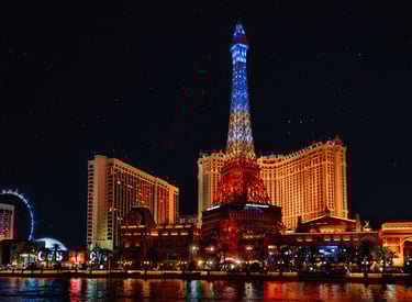 a cityscape of a city with a tower in the background