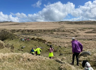 A group of runners running across Dartmoor