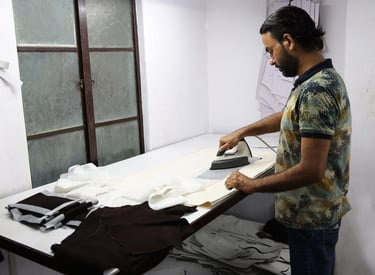 Man adding fusing to a leather panel