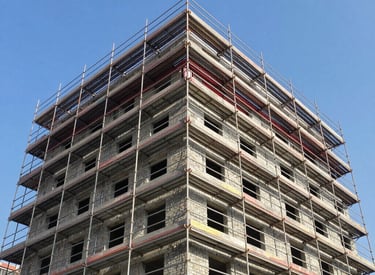 Wide shot of scaffold structures supporting renovation work in Querétaro
