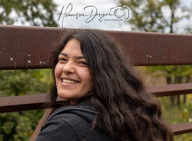 a woman with long hair and a black jacket