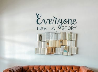 Books displayed beneath the words 'Everyone has a story