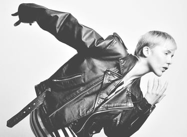 a woman in a leather jacket