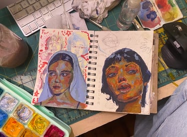 Takara's artist workstation depicted here—paints & two paintings, "Far" &"Letting Go" in process.