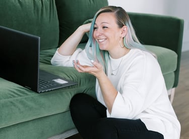 Tabitha with butterfly effect consulting on her laptop talking to a client