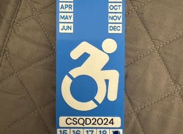3d printed disability plaque in blue, white and black colors