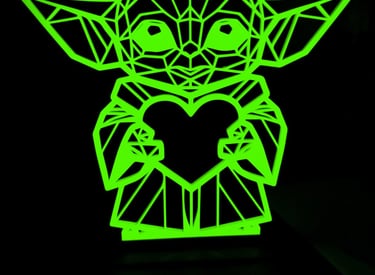 a green glow in the dark 3d printed yoda art statue