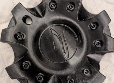 black 3d printed car wheel disc cap with logo