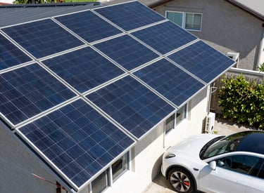 A panoramic view of a large-scale renewable energy wind farm at sunset.