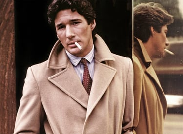 Richard Gere in American Gigolo (1980) wearing a Giorgio Armani camel coat.