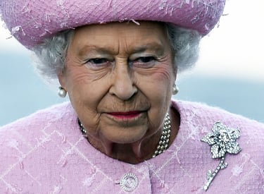 Queen Elizabeth II wearing the Cartier Williamson Pink Diamond Brooch.