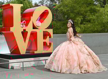 quinceanera girl in front of Love sign