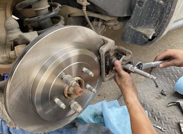 Image of our technician installing brand new brakes