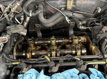 Image of a rear valve cover removed on a nissan maxima
