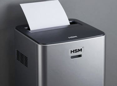 Secure document destruction machine in action at a business office.