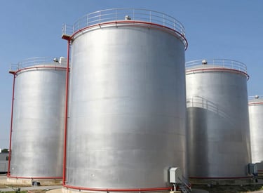 Marine engineer performing maintenance on a ship's engine at a dockside facility.